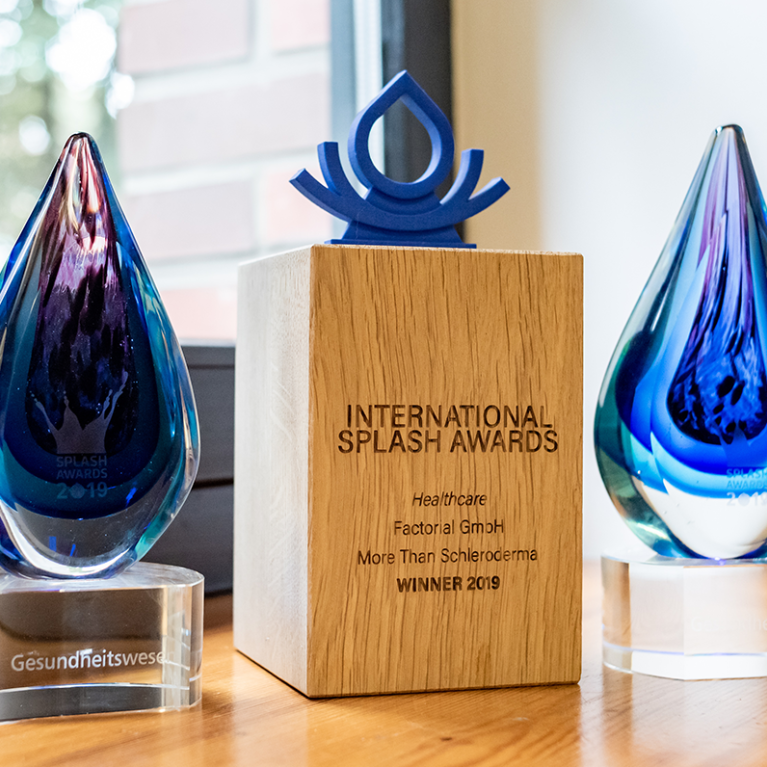 Image showing twe Splash Awards trophies that Factorial won in previous Splash Awards' editions