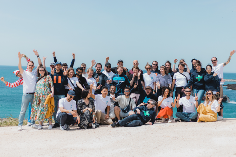 Image showing the Factorial team standing at the coastline in Ericeira, Portugal