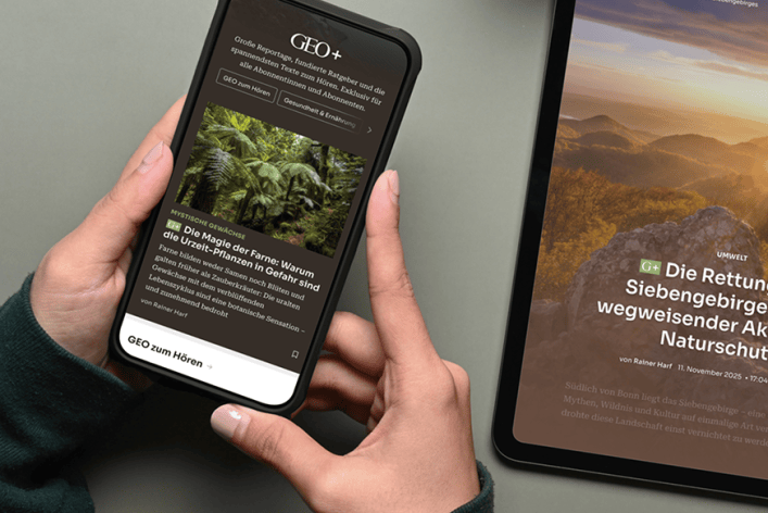 A smartphone and the edge of a tablet display the new website for the GEO brand.