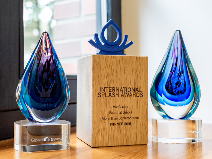 Image showing twe Splash Awards trophies that Factorial won in previous Splash Awards' editions